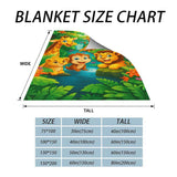 Kuschelige Flanell­decke mit Cartoon-Dschungelmotiv